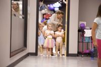 young dancers await their turn to begin ballet class